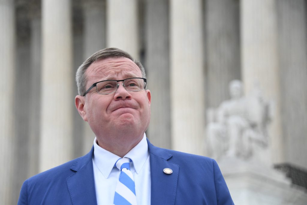 Republican speaker of the North Carolina House of Representatives, Tim Moore, speaks to the press in front of the US Supreme Court in Washington, DC, on December 7, 2022. - The US Supreme Court hears arguments in Moore v. Harper, a case brought by North Carolina Republicans led by Moore and which could fundamentally alter the way democracy operates in America, by expanding the power of state legislatures over elections for the White House and Congress. (Photo by OLIVIER DOULIERY / AFP) (Photo by OLIVIER DOULIERY/AFP via Getty Images)